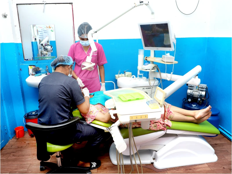 Dental care procedure in progress in the treatment room